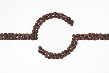 Composition of coffee beans in the form of a line with a circle in the center in a flat lay. The concept of making a drink. Top view with copy space.