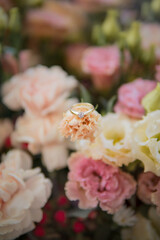 golden engagement ring on the flowers 