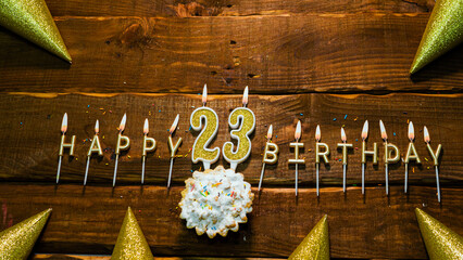 the candle with the number happy birthday, the background of the pie with candles happy birthday on...
