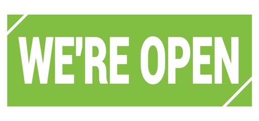 WE'RE OPEN text written on green stamp sign.