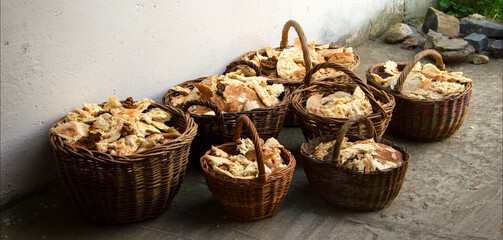 Pieces of five loaves in seven baskets. Biblical miracle
