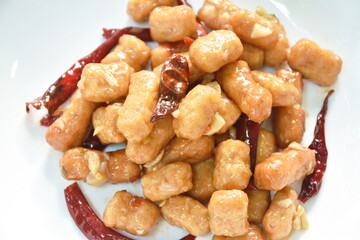 fried chicken meat with dry chili on plate