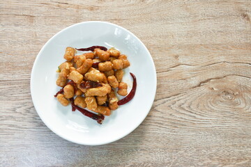 fried chicken meat with dry chili on plate