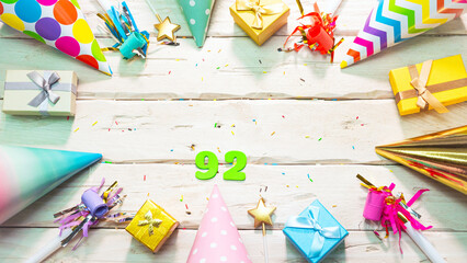 Beautiful colorful greeting card on the background of white boards happy birthday copy space. Beautiful ornaments and decorations festive background. Happy birthday number 92
