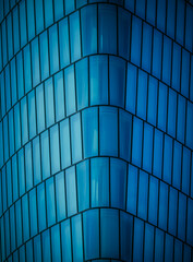 blue glass wall of a modern building