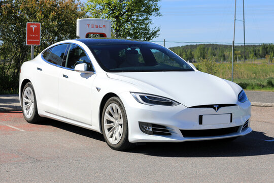 White Tesla Model S Electric Car Supercharging Battery.