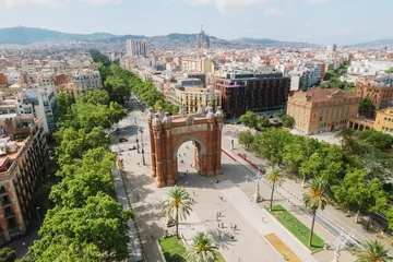 Tuinposter Aerial view of Barcelona Urban Skyline and The Arc de Triomf or Arco de Triunfo in spanish, a triumphal arch in the city of Barcelona. Sunny day. © Brastock Images