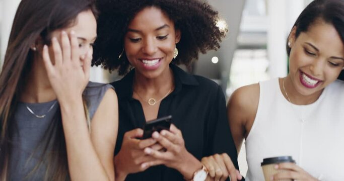 Happy Women Walking, Having Fun And Talking While Reading A Text On A Phone Together Outside. Diverse Friends Laughing And Discussing A Message. Carefree Females Enjoying A Social Conversation