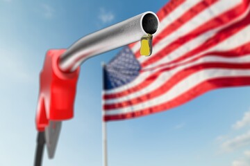 Gas dripping from fuel nozzle with American flag. Gasoline shortage, price concept.