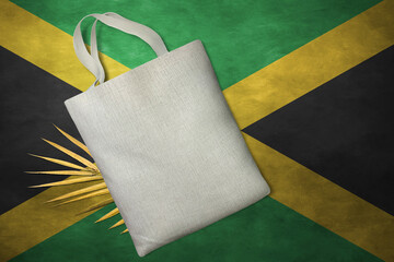 Patriotic tote bag mock up on background in colors of national flag. Jamaica