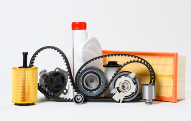 New spare parts for car repair and maintenance on a white background.