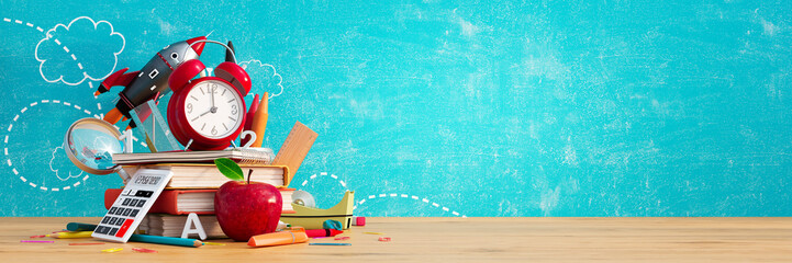 Red alarm clock with apple and books. Back to school concept on blue chalkboard background 3D...