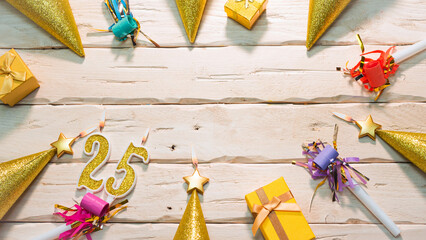 Beautiful colorful card on the background of white boards happy birthday in golden hues copy space. Beautiful ornaments and decorations of gold color festive background. Happy birthday number 25
