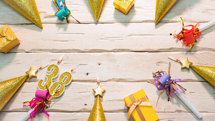 Beautiful colorful card on the background of white boards happy birthday in golden hues copy space. Beautiful ornaments and decorations of gold color festive background. Happy birthday number 38