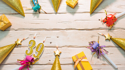 Beautiful colorful card on the background of white boards happy birthday in golden hues copy space. Beautiful ornaments and decorations of gold color festive background. Happy birthday number 39