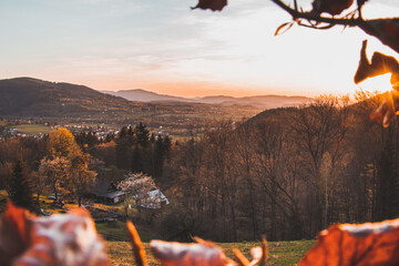Sunset over the Moravian-Silesian part of the Czech Republic in Beskydy mountains. Orange glow of...