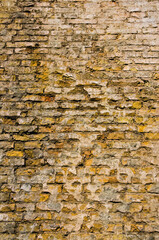 Background of brick wall texture. Mixed color industrial brick wall. Tiled. Vintage effect. Yellow brick wall background in rural building