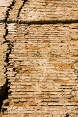 Old textured brick wall with natural defects. Scratches, cracks, crevices. Background of brick wall texture. Mixed color industrial brick wall. Tiled. Vintage effect