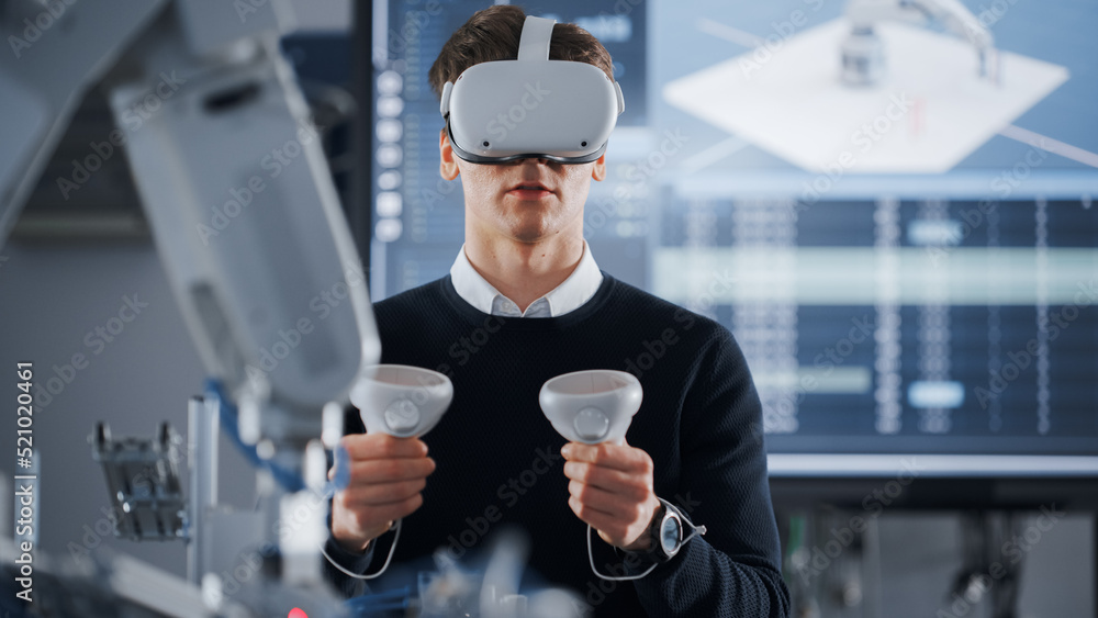 Poster Male Student in VR Goggles Lifting and Moving Bionic Hand With Controllers While Doing His Project at the University of Technology. Computer Science and Robotics Education Concept.