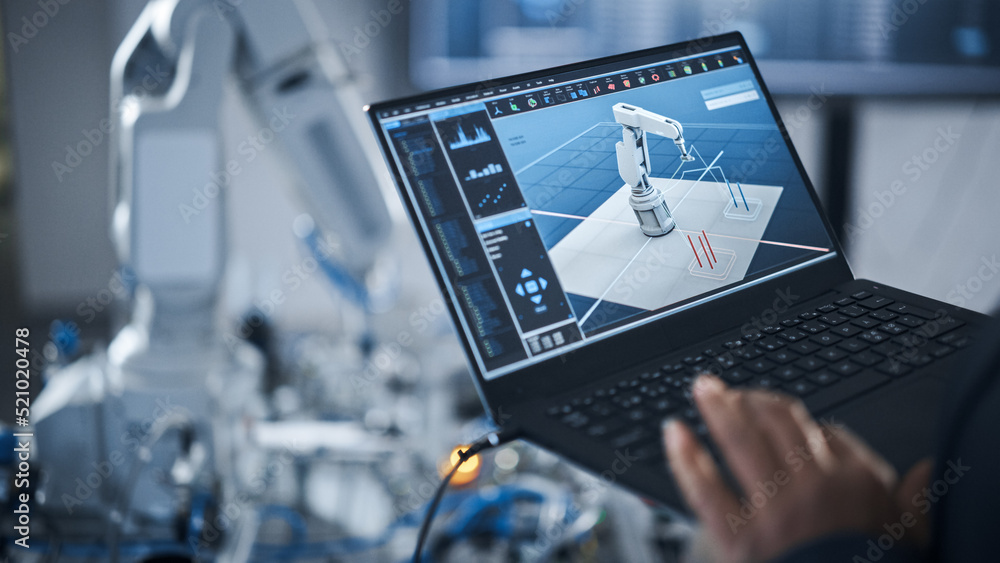 Poster Black Female Engineer Using Laptop for Programming Robotic Arm At the Modern Assembling Factory. New Generation of Advanced Technology in Automatic Manufacturing Industry Concept.