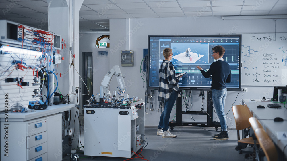 Poster two male and female students standing near big screen and discussing program for motion of robotic a