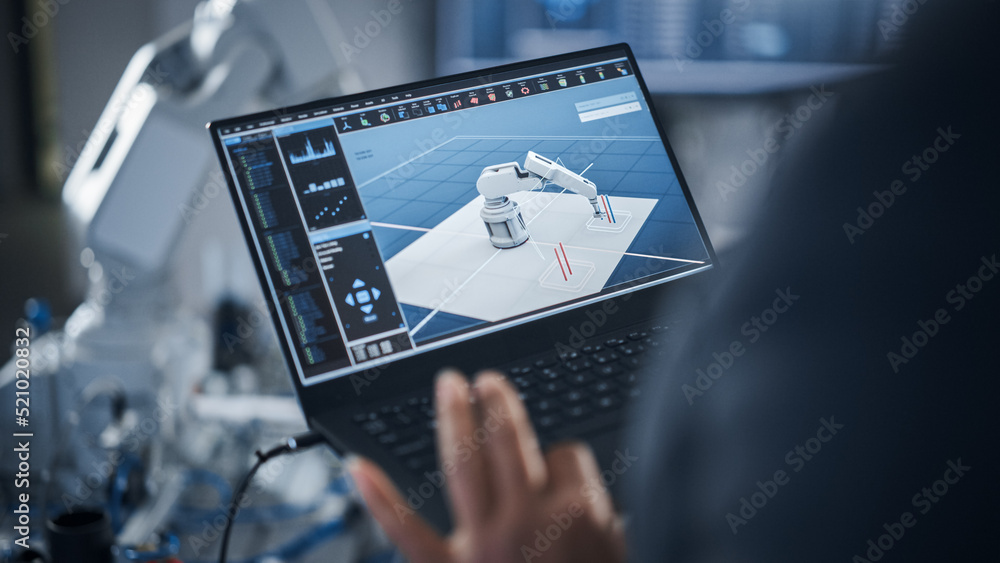 Poster black female engineer using laptop for programming robotic arm at the futuristic advanced factory. n