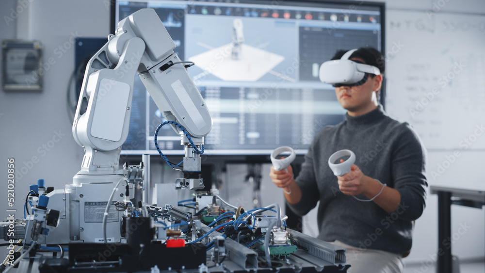 Poster Asian Student Testing Interface of Bionic Hand. Engineer Wearing Virtual Reality Headset and Using Controllers at Modern University of Technology Classroom. Virtual Reality Concept.