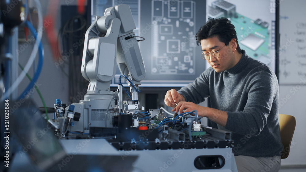 Aufkleber Asian Student Assembling Robotic Arm with Screwdriver During the Lesson. Robot is Moving. Computer Motherboard Components at Digital Interactive Whiteboard at Background. Education Concept
