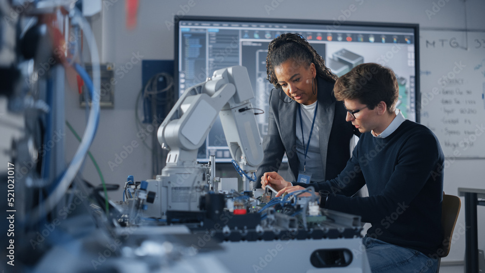 Poster male student engineer discussing ideas with black teacher while working with computer processor. man