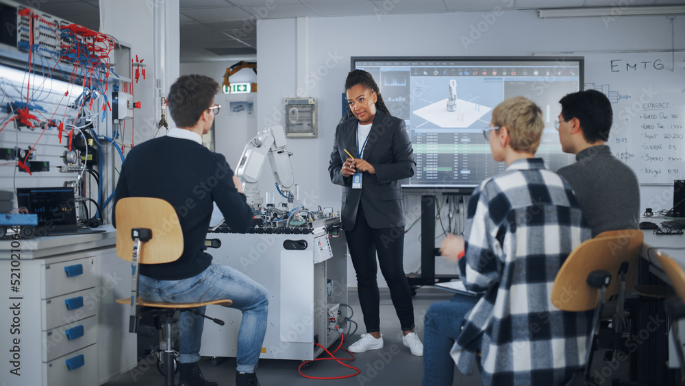 Poster Teacher is Explaining Principles of Working With Robotic Hand, Showing Examples on Big Screen at Modern University. Teenagers Brainstorming and Asking Questions. Robotic Engineering Concept.