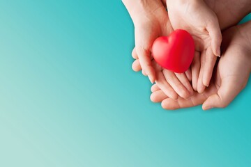 Adult and children holding heart on background. World cancer day.
