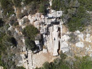 aerial top shot drone of statue (kouros) apollonas in naxos island, greece, with copy space