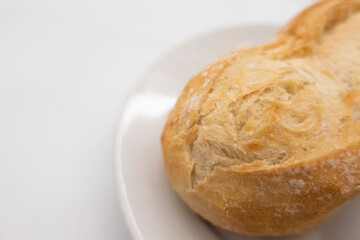 appetizing freshly baked bread on a white plate