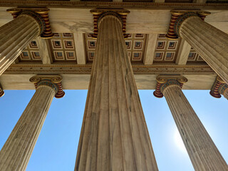 close up photo from red a blue columns of academy of athens in greece, europe