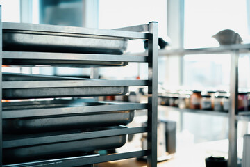 Interior professional restaurant kitchen, rack with baking sheets