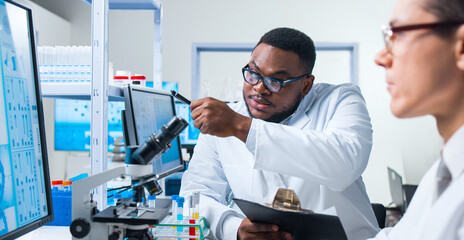 Professional Doctors Doing Monkeypox Research in a Modern Futuristic Laboratory. Lab Experiments in...