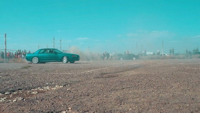 Drifting car, professional driver drifting car on asphalt race track. smoke and dust.