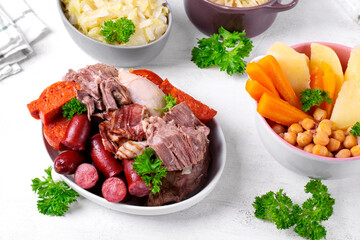 Cocido madrileno, traditional Spanish hot meal with assorted stewed meat, vegetable, chickpea and...