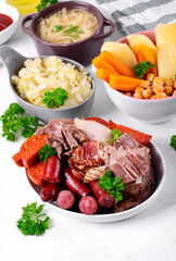 Cocido madrileno, traditional Spanish hot meal with assorted stewed meat, vegetable, chickpea and...