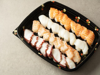 Various types of sushi in packaging