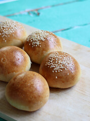 Home made burger buns close up photo. Sourdough bread on a table. Eating healthy concept. 