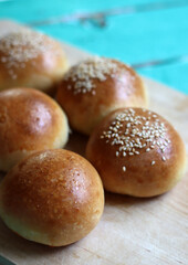 Home made burger buns close up photo. Sourdough bread on a table. Eating healthy concept. 