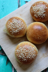 Home made burger buns close up photo. Sourdough bread on a table. Eating healthy concept. 