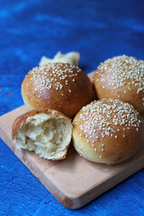 Home made burger buns close up photo. Sourdough bread on a table. Eating healthy concept. 