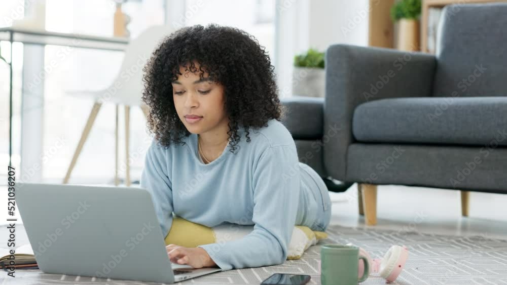 Aufkleber Relaxed and comfortable university student typing on laptop and doing a homework assignment, studying for a test or writing an academic essay. Smart, busy and thinking young woman lying on the floor