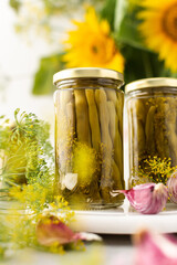 Preparing for autumn and winter, canned asparagus beans in jars, pickled or fermented vegetables