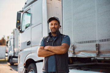 Portrait of professional truck driver looking at camera. - obrazy, fototapety, plakaty