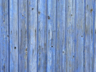 a light blue painted washed out plank wall