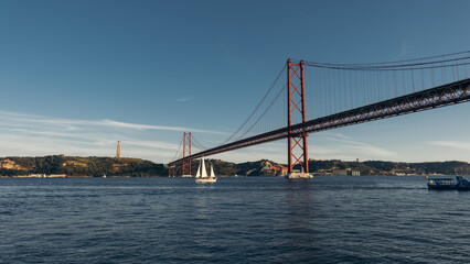 Fototapeta na wymiar 25 Abril Bridge in Lisbon at suset