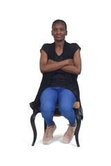 full portrait of a serious woman sitting on chair over white background